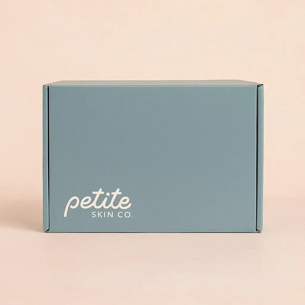 Blue box with 'petite SKIN CO' text on a beige background