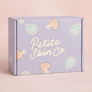 Pastel purple Signature Boxes with playful heart and droplet shapes in pink and teal, designed for gentle Australian made skincare for children aged 7 to 14. Good Skin Habits Start Early.