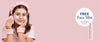 A woman with a white face mask applies a pink facial mist using a pink sponge, set against a solid pink background. On the right, a promotional badge reads FREE Face Mist when you spend $149+ next to an illustration of the pink spray bottle.