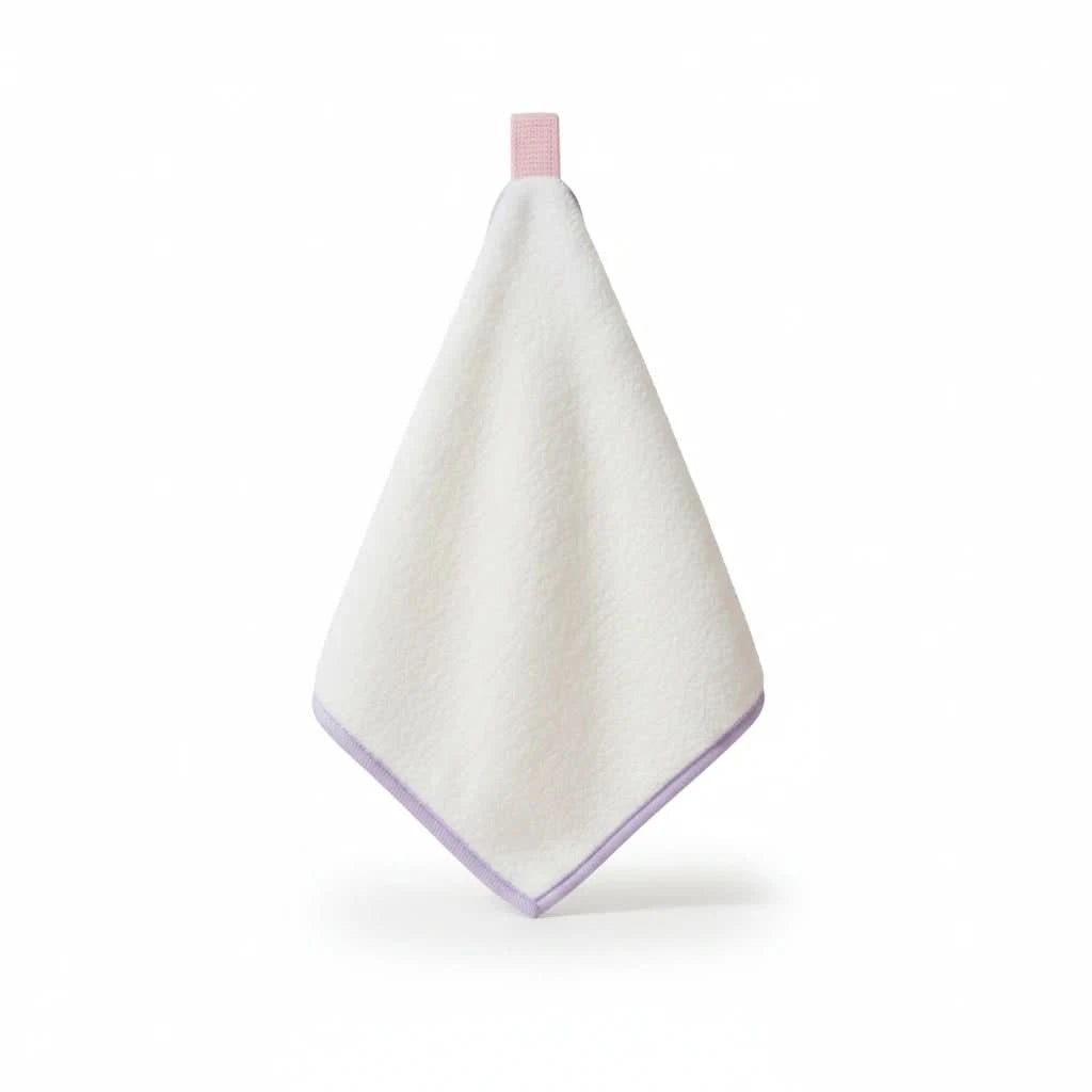 White towel with purple trim on a white background