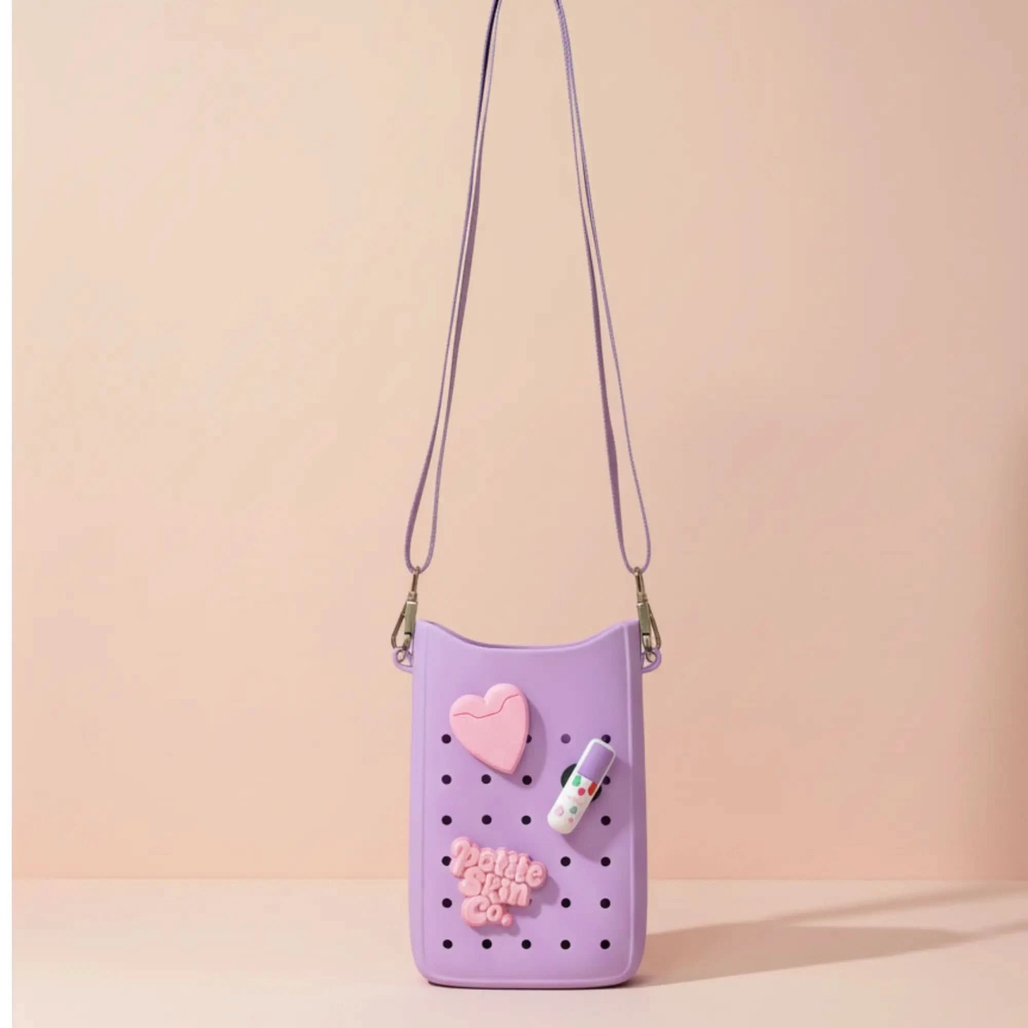 Petite Crossbody Bag in pastel lavender with heart and skincare-themed decorations, Australian made, designed for young skin aged 7 to 14, promoting good skin habits start early.