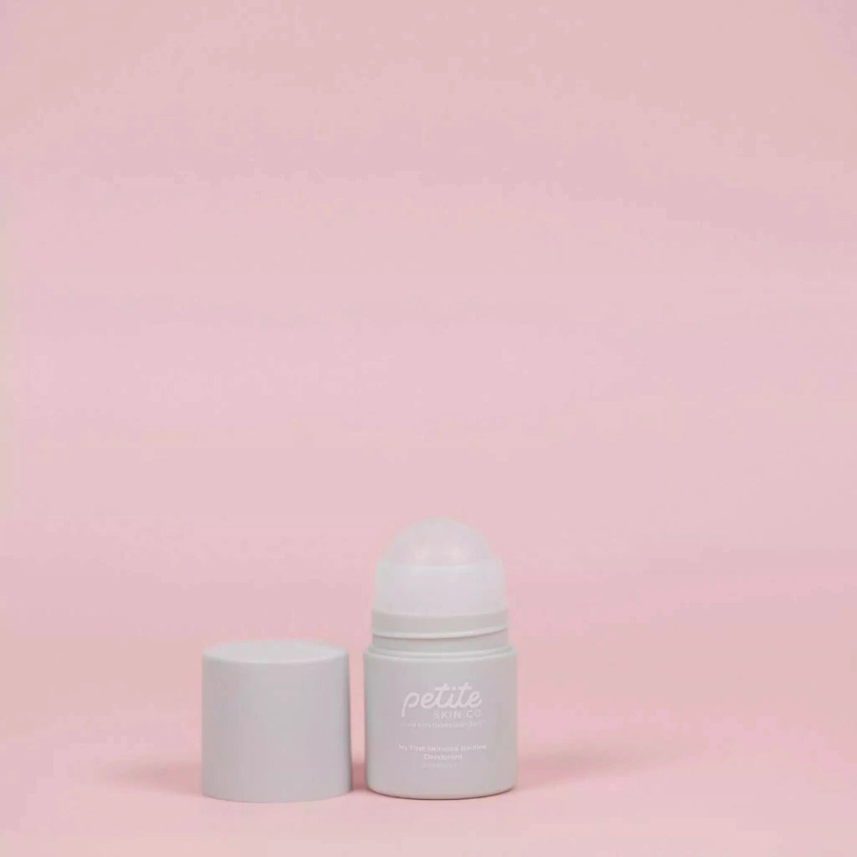 Open small white roll-on Deodorant container on soft pink background, Australian made natural skincare for sensitive underarm skin, designed for 7 to 14 year olds, Good Skin Habits Start Early.