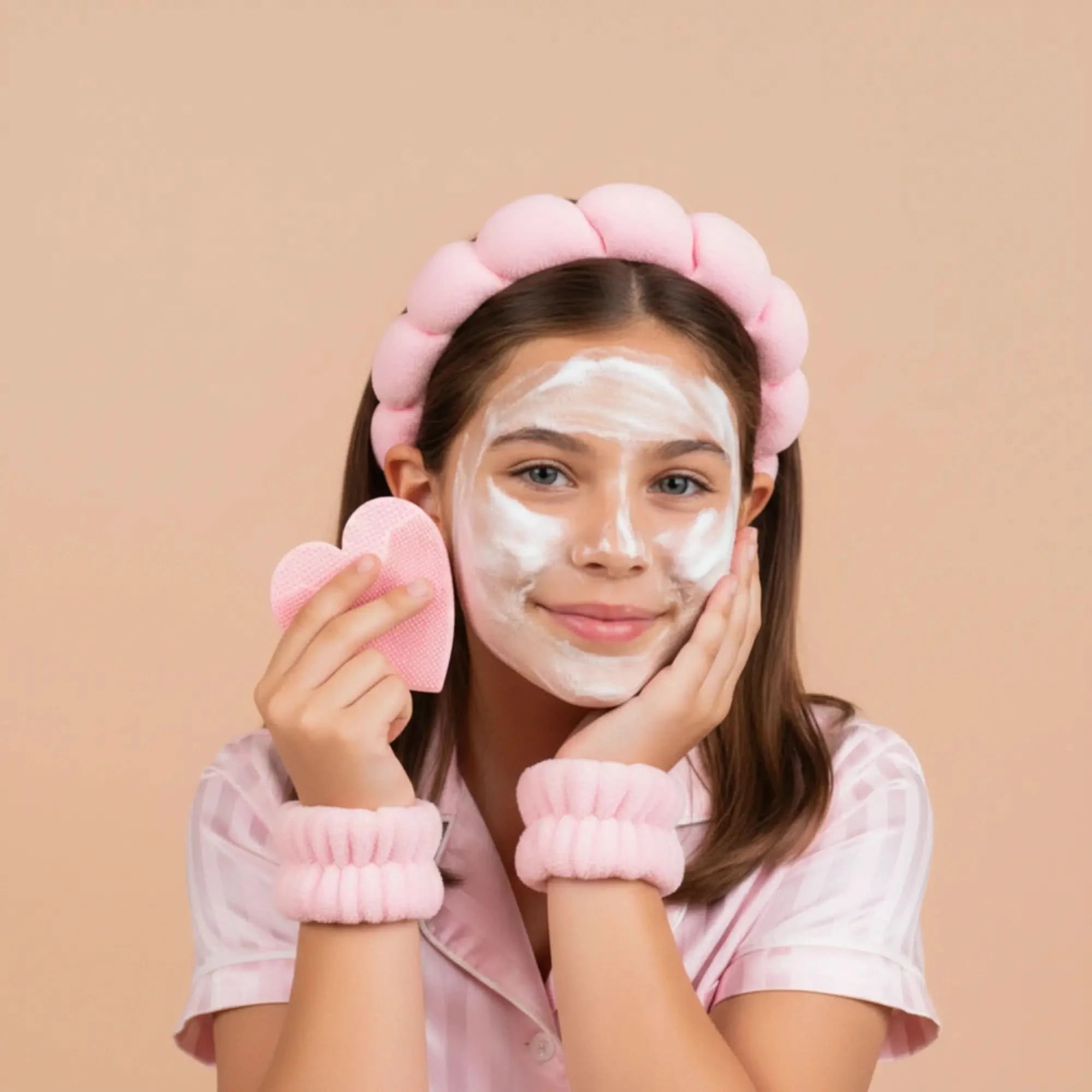Young girl with gentle face cleanser on her skin wearing the Bubble Headband & Cuff Set, promoting Australian made natural skincare for 7 to 14 year olds with the tagline Good Skin Habits Start Early.