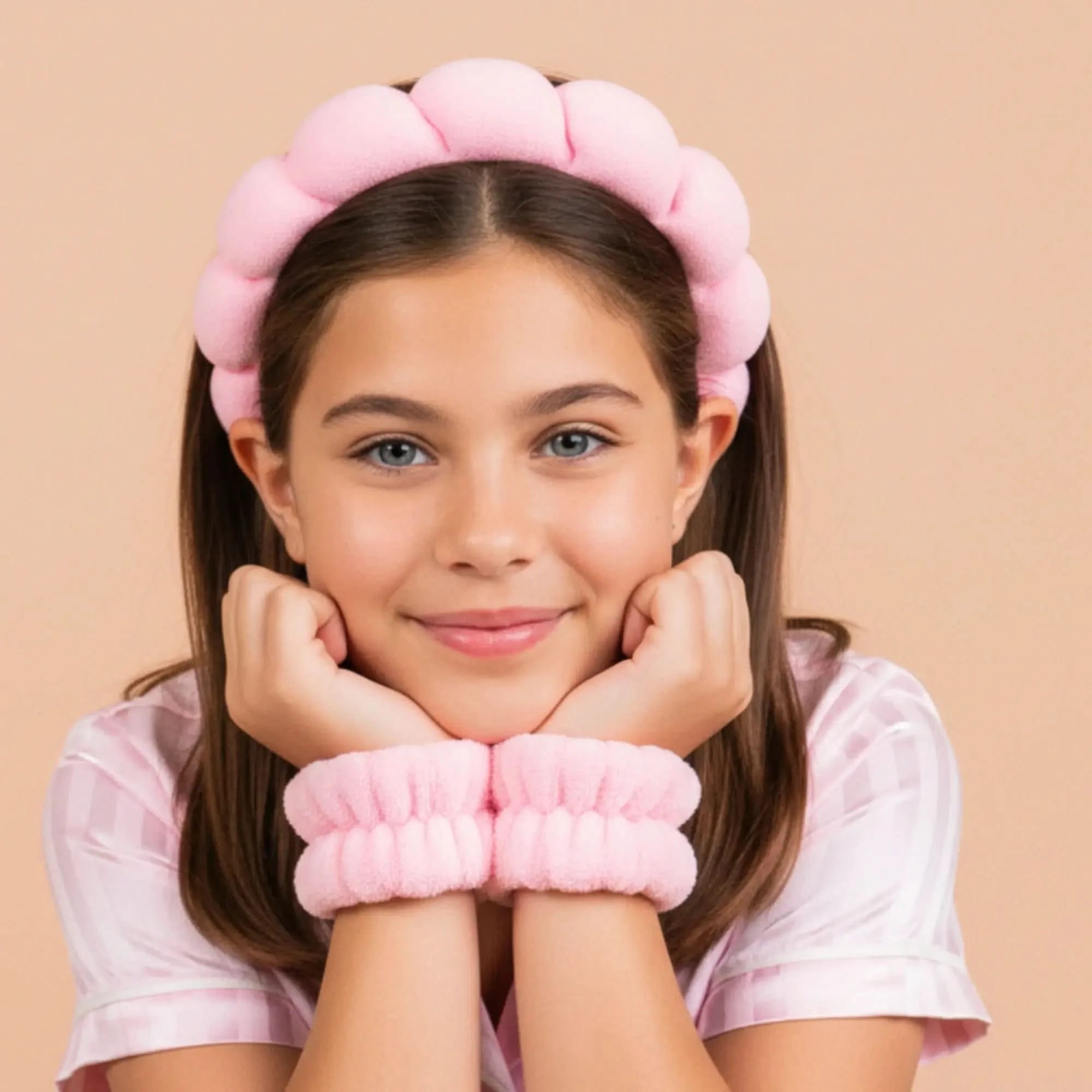 Young girl wearing a soft pink Bubble Headband & Cuff Set, demonstrating gentle Australian made accessories designed for the biology of 7 to 14 year old skin. Good Skin Habits Start Early.