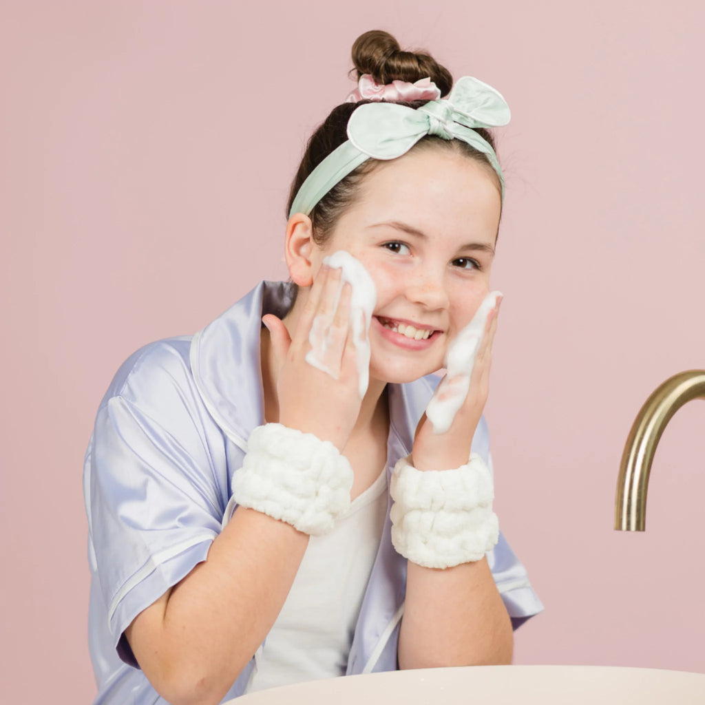 12 year old girl using Face Wash wearing Petite Skin Co. Dry Cuffs
