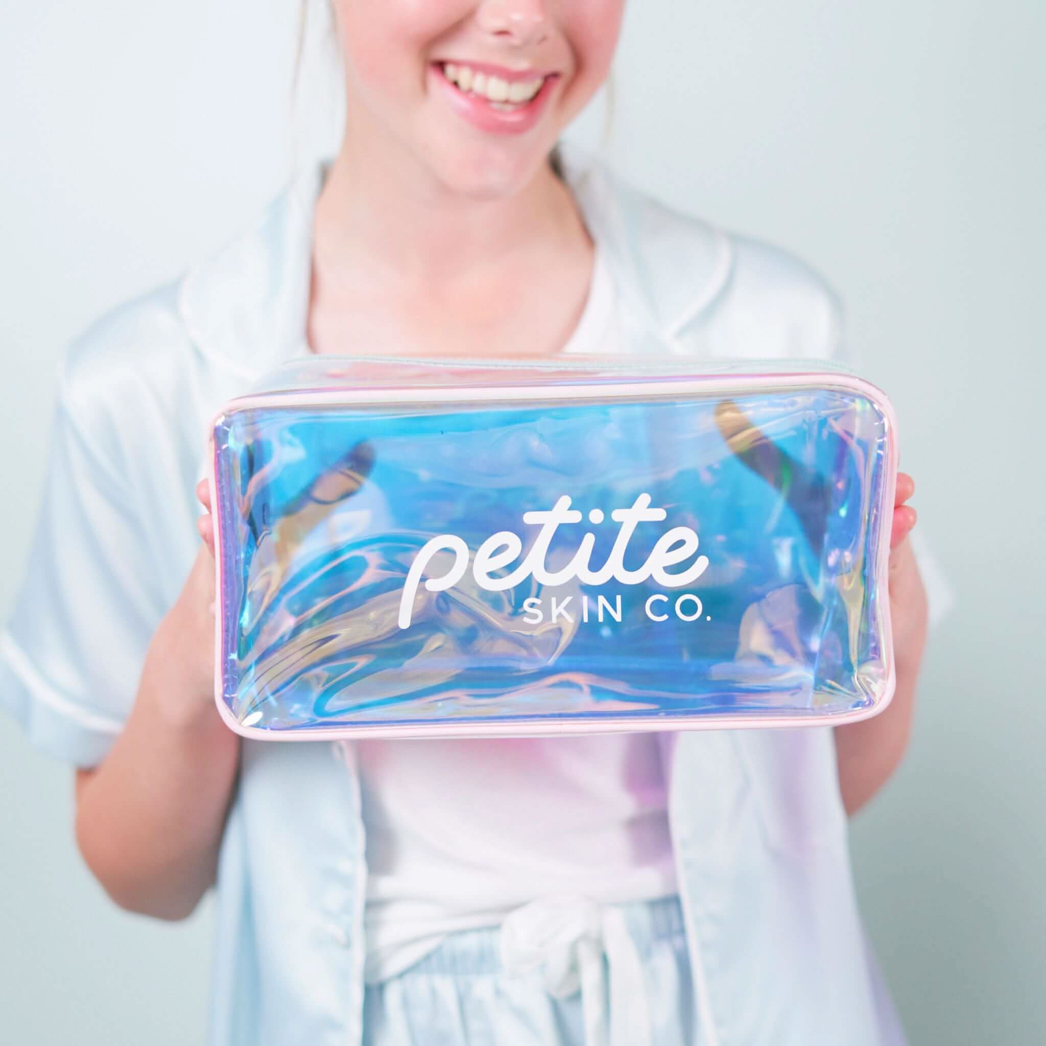 Young person holding a Holographic Skincare Bag with the Petite Skin Co. logo, designed for Australian made, natural skincare routines for 7 to 14 year olds. Good Skin Habits Start Early.
