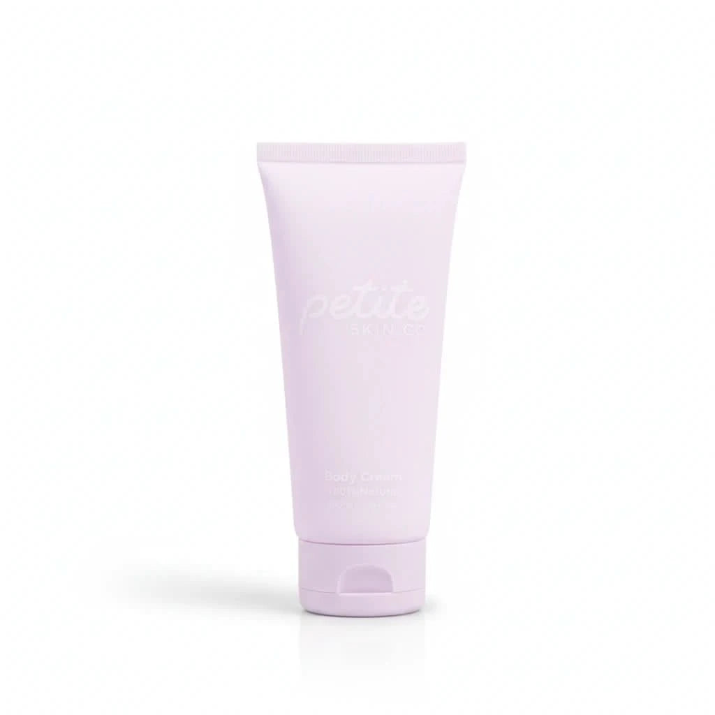 Purple tube of petite skin co.body cream on a white background