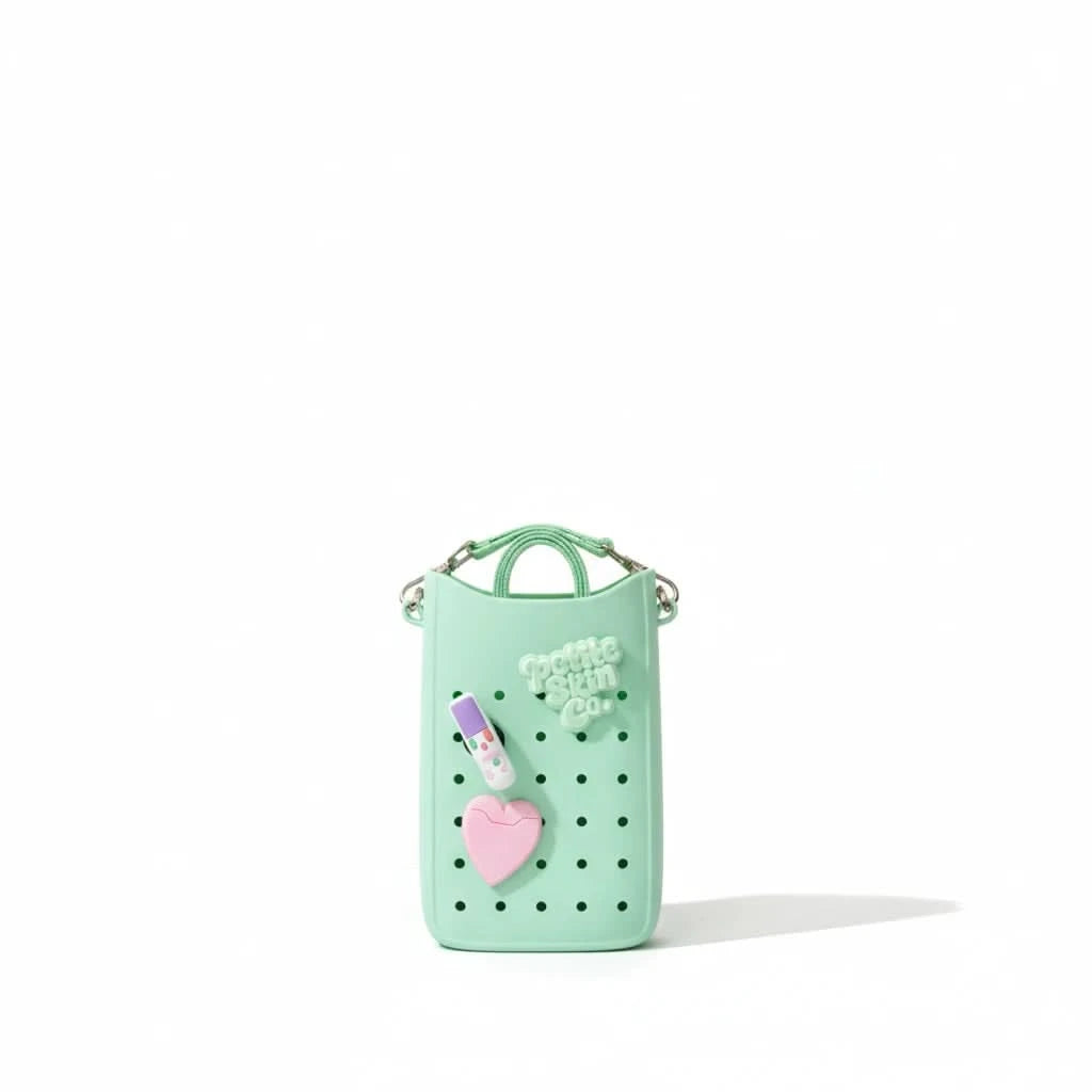 Mint green Petite Crossbody Bag featuring ventilation holes, a lip balm and heart charm, designed with gentle, natural Australian made values for 7 to 14 year olds. Good Skin Habits Start Early.