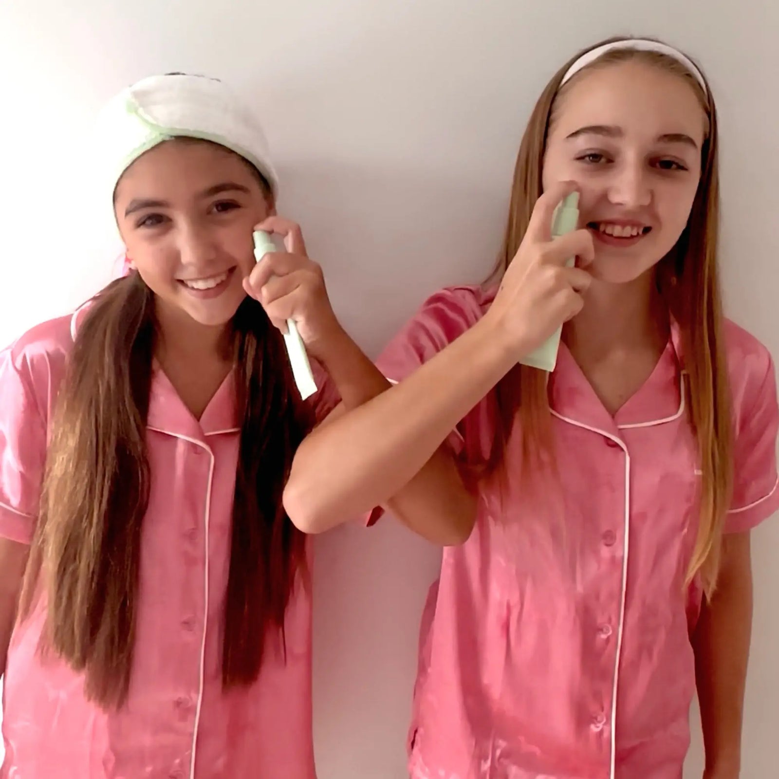 Two girls in pink pajamas demonstrate the Night Time Routine | Confetti Collection using gentle skincare tools, promoting Australian made, natural products designed for 7 to 14 year old skin. Good Skin Habits Start Early.