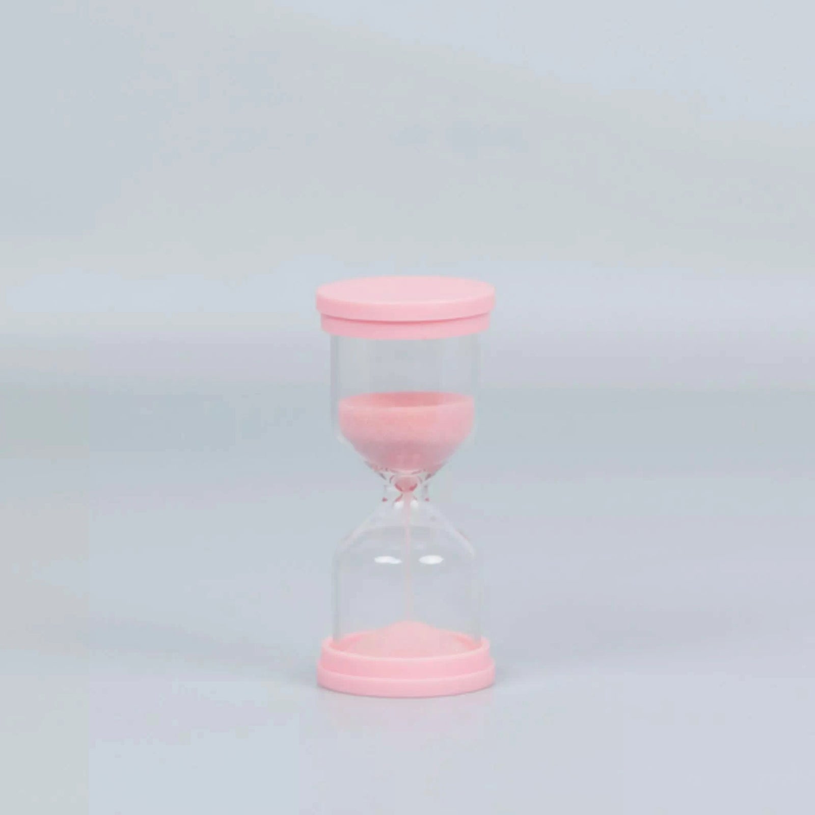 60 Second Skincare Timer with pink borosilicate glass and sparkly silica sand, Australian made for kids aged 7 to 14, promoting good skin habits with gentle, natural skincare.