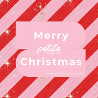 Festive pink and red striped Christmas card with white text reading "Merry Christmas" and Petite Skin Co. logo, promoting "Is this a Gift?" Australian made skincare for 7 to 14 year olds. Good Skin Habits Start Early.