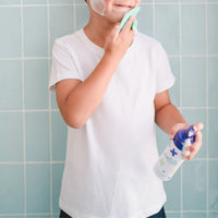 Child using Teardrop Shape Skin Buffers with face cleansing foam in bathroom, demonstrating gentle Australian made skincare for 7 to 14 year olds, promoting good skin habits.