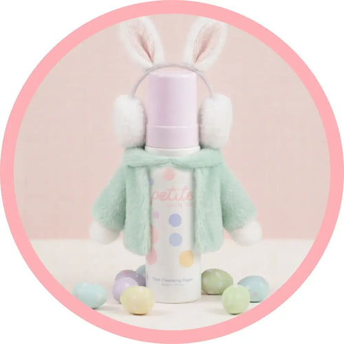 Face Cleansing Foam bottle with bunny ears and pastel colors on a pink background