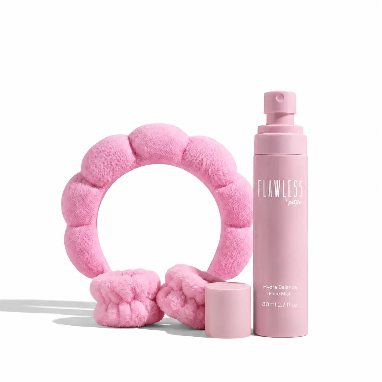 Pink plush headband and matching scrunchies paired with a pink bottle of face product for kids, featuring the Daily Refresh Set, Australian made, natural, good skin habits start early.