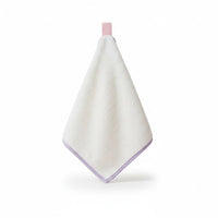 White towel with purple trim on a white background