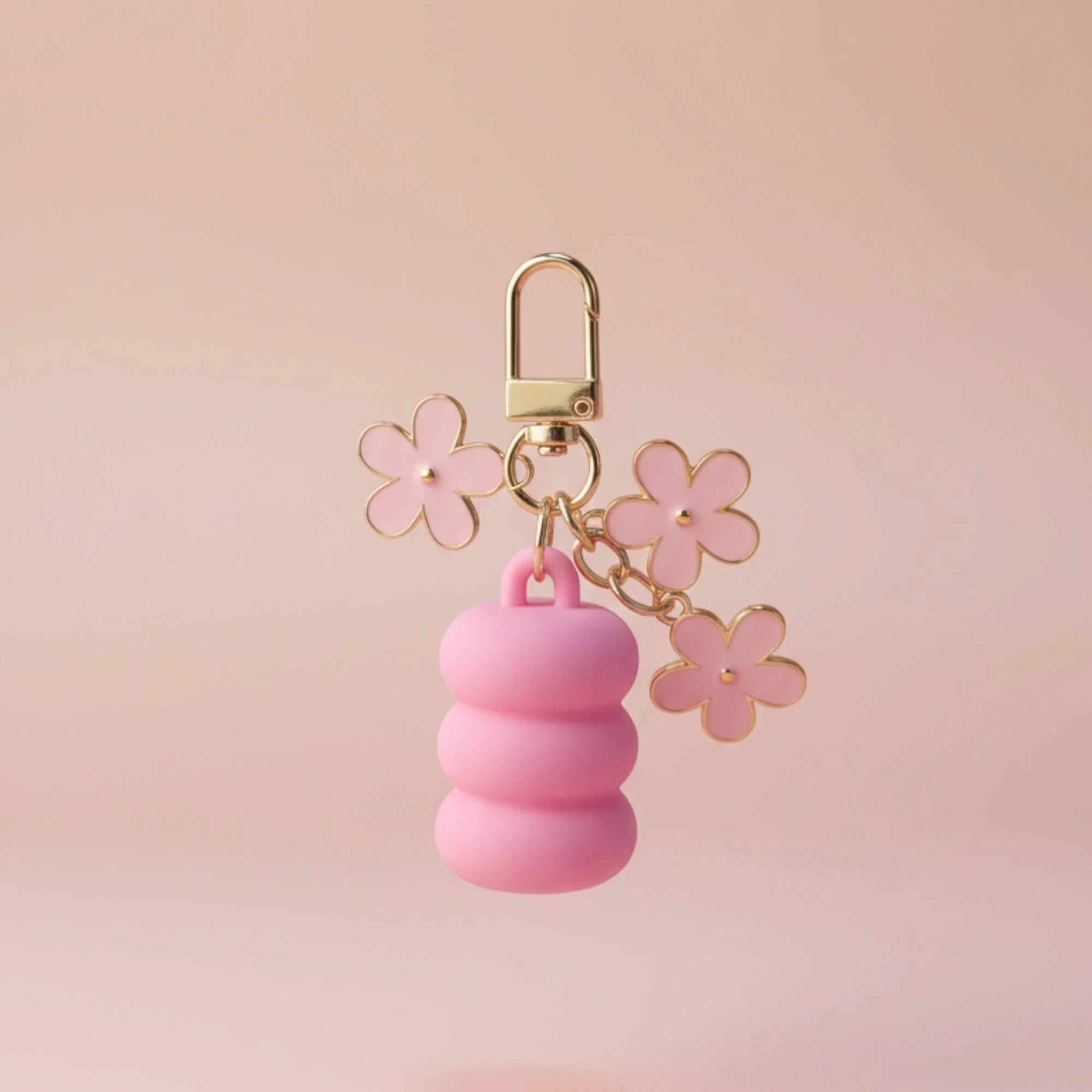 Pink keychain with flowers on a pink background