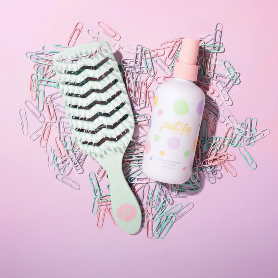 Hairbrush and spray bottle from Good Hair Habits Routine by Petite Skin Co., Australian made natural detangler for 7 to 14 year olds, promoting good skin habits start early.