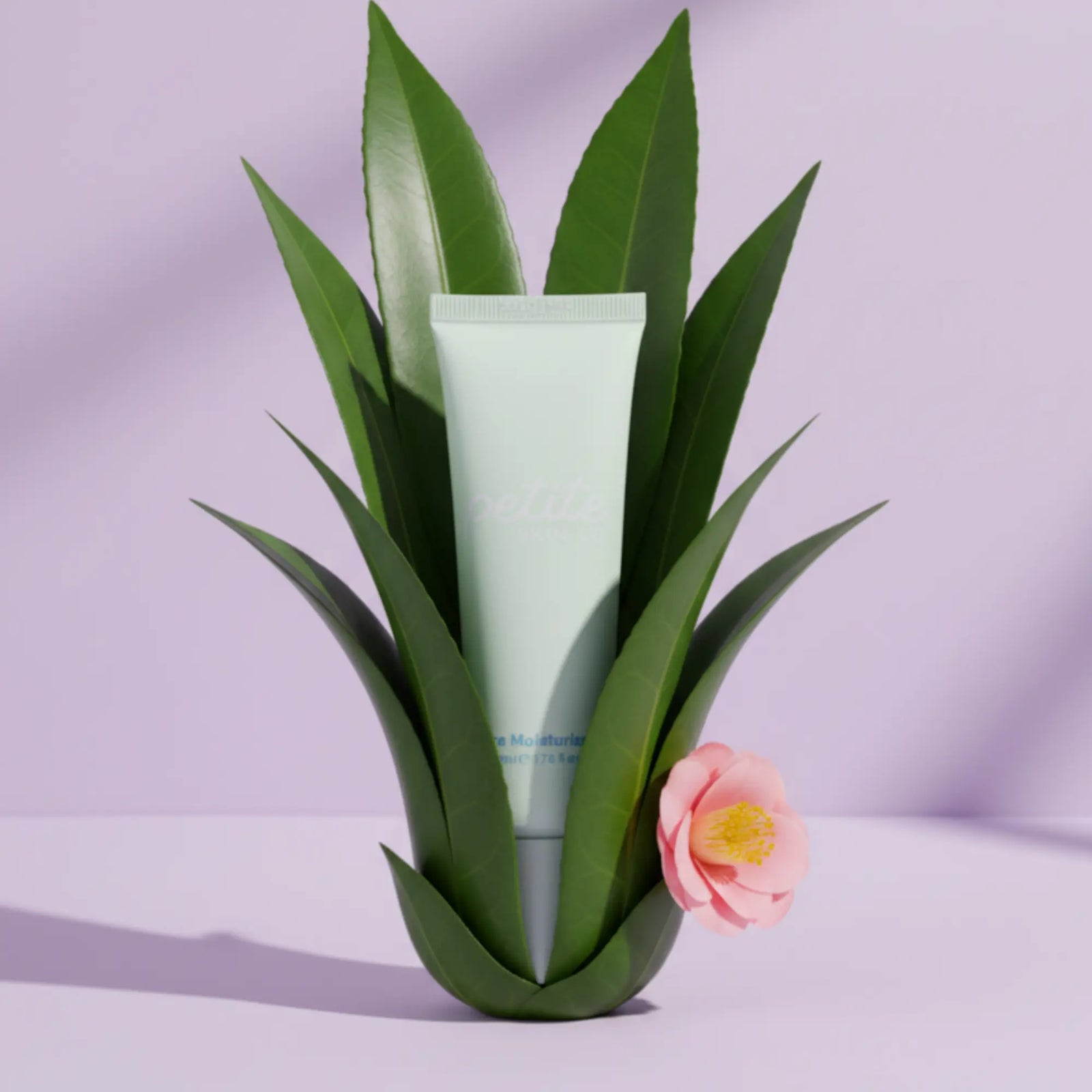 Tube of Daily Duo Kit | Crosses Collection standing upright, surrounded by green aloe leaves and a pink flower, representing Australian made, natural skincare for 7 to 14 year olds.