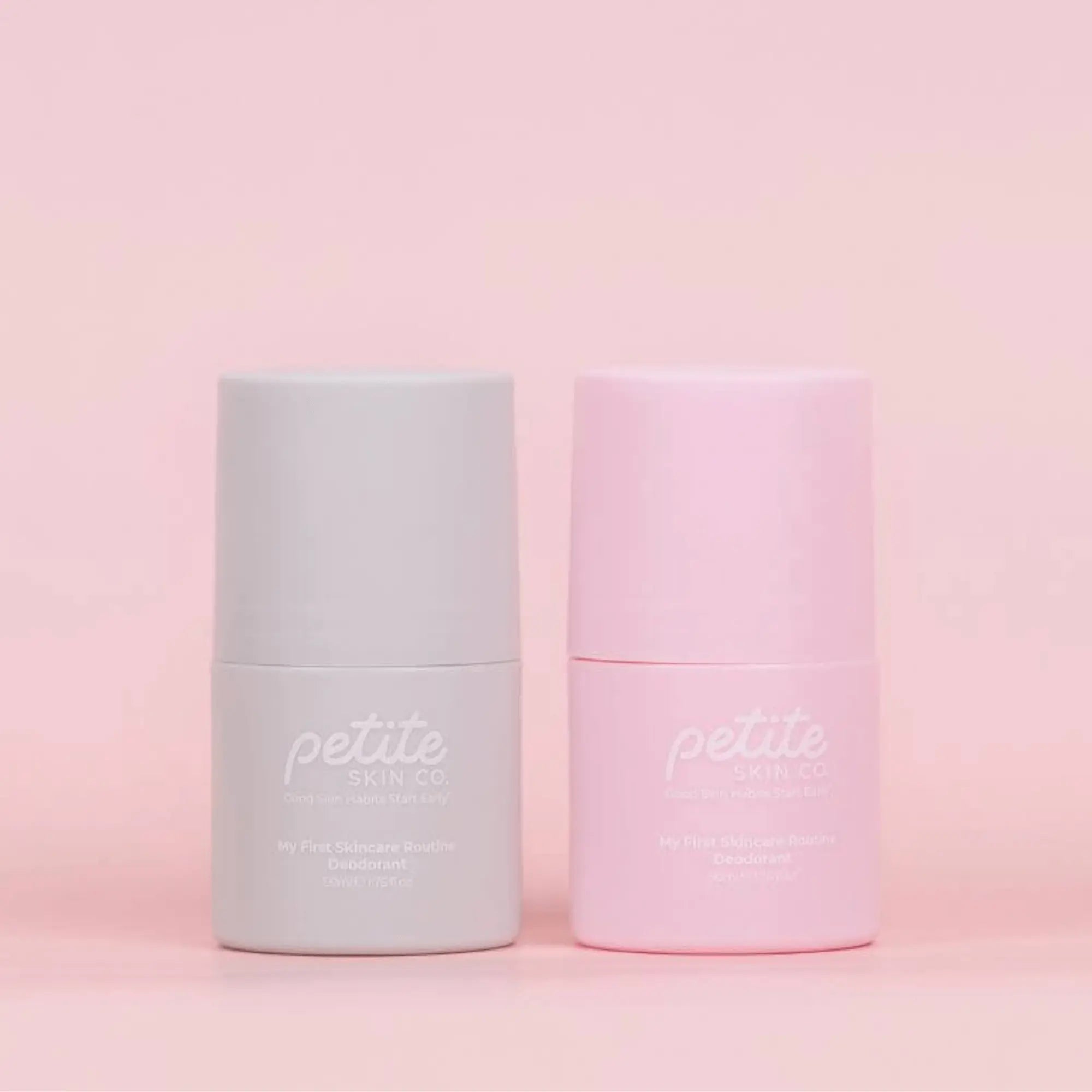 Two cylindrical skincare deodorants labeled 'petite skin co' on a pink background