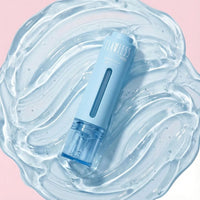 Clear and Balanced Duo blemish serum in a pastel blue container resting on a smooth, gel-like substance, Australian made natural skincare for 7 to 14 year olds, good skin habits start early.