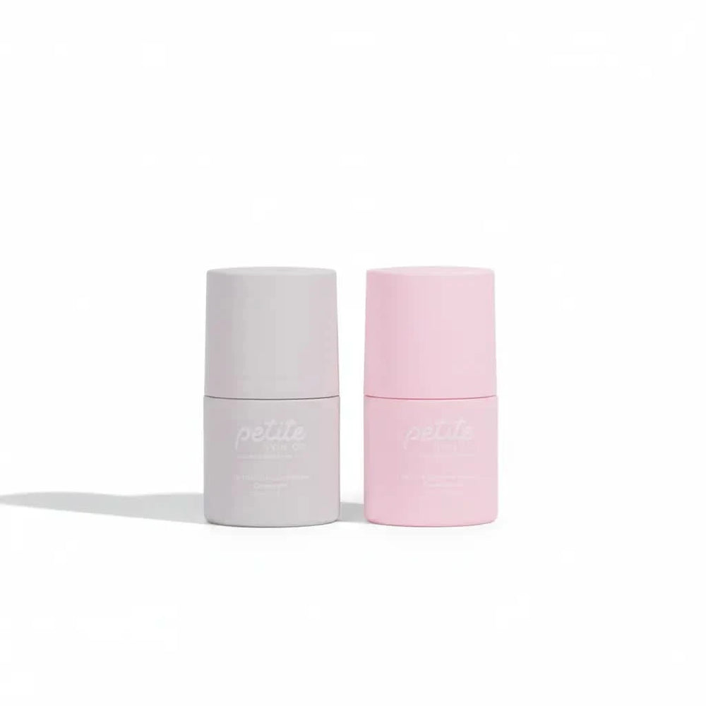Two compact deodorant sticks in soft pastel grey and pink colors designed for young sensitive skin, Australian made by Petite Skin Co. Good Skin Habits Start Early.