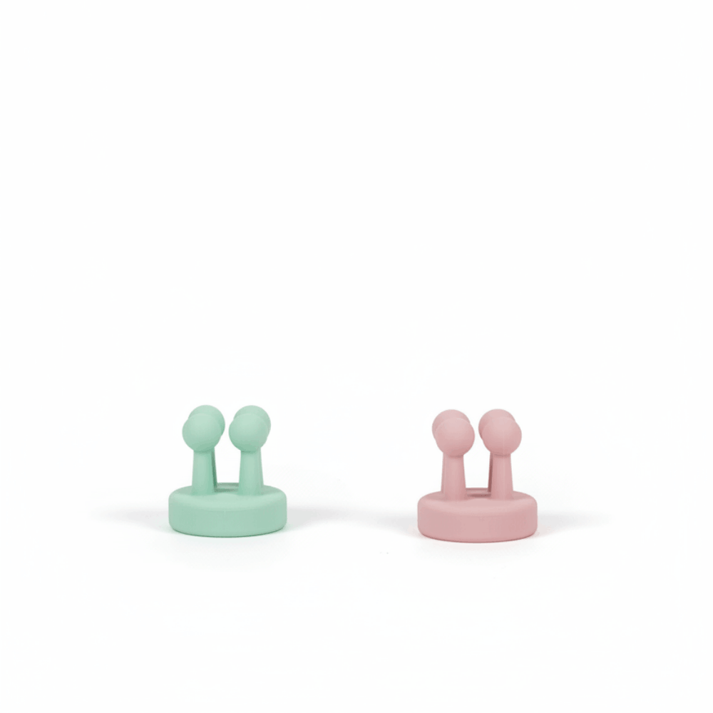 Two Daily Essentials Hook pieces in mint and pink colors made of high-quality water-resistant plastic, featuring strong adhesive backing for easy, damage-free installation. Australian made, supporting good skin habits start early.