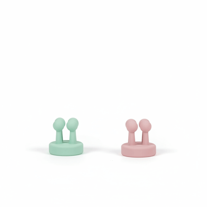 Two Daily Essentials Hook pieces in mint and pink colors made of high-quality water-resistant plastic, featuring strong adhesive backing for easy, damage-free installation. Australian made, supporting good skin habits start early.