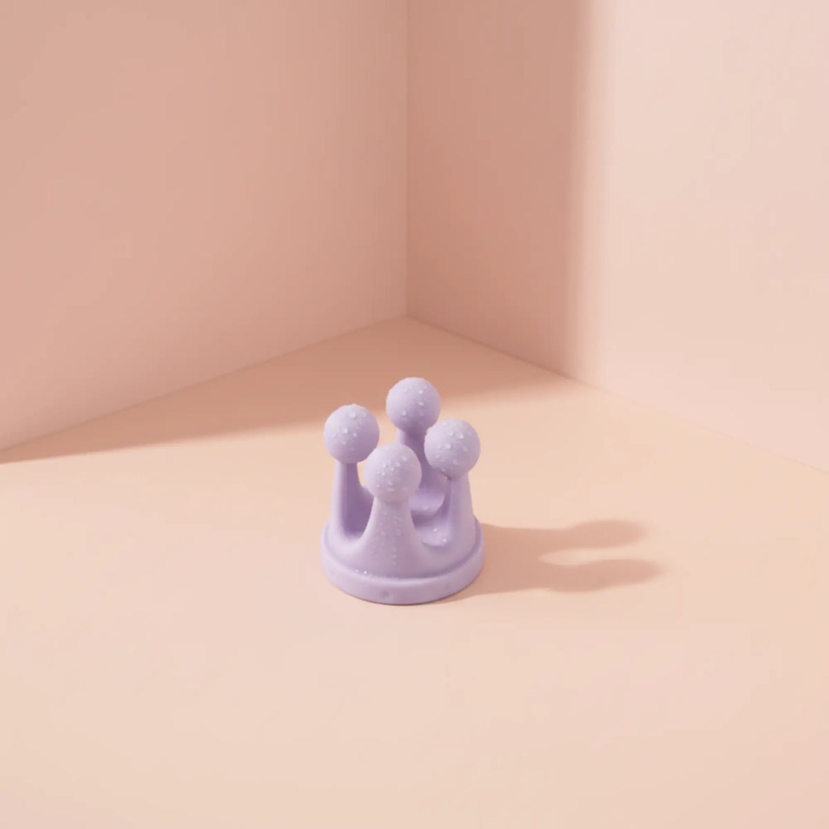 A small lavender silicone bathroom hook.