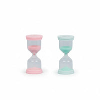 Two 60 Second Skincare Timer hourglasses in pink and mint colors made from sturdy borosilicate glass with sparkly silica, designed to promote good skin habits in children aged 7 to 14.
