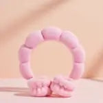 Pink bubble headband and cuffs on a pink background