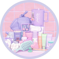Pastel-colored beauty products and accessories on a pink tiled background