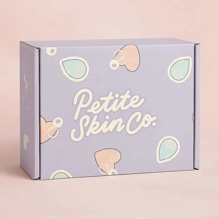 Pastel purple gift box with cute teardrop and heart shapes featuring the text "Petite Skin Co.", representing the "Is this a Gift?" Australian made natural skincare for 7 to 14 year olds, promoting good skin habits start early.